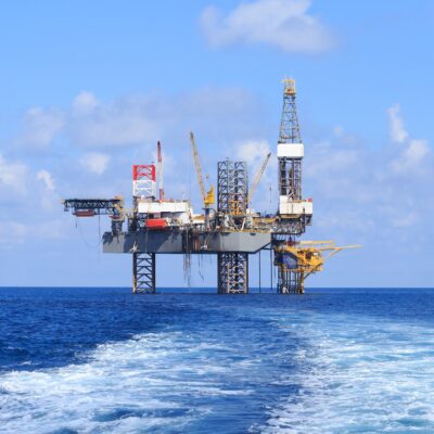 Offshore Jack Up Drilling Rig Over The Production Platform in The Middle of The Sea